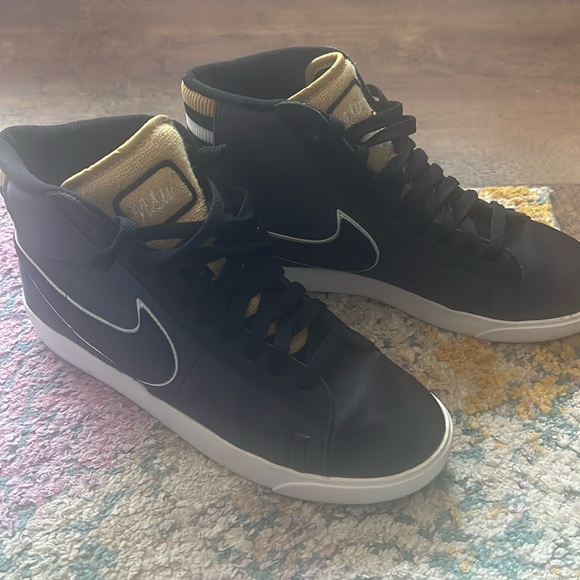 Nike Shoes - Nike women’s black and gold high tops size 7.5